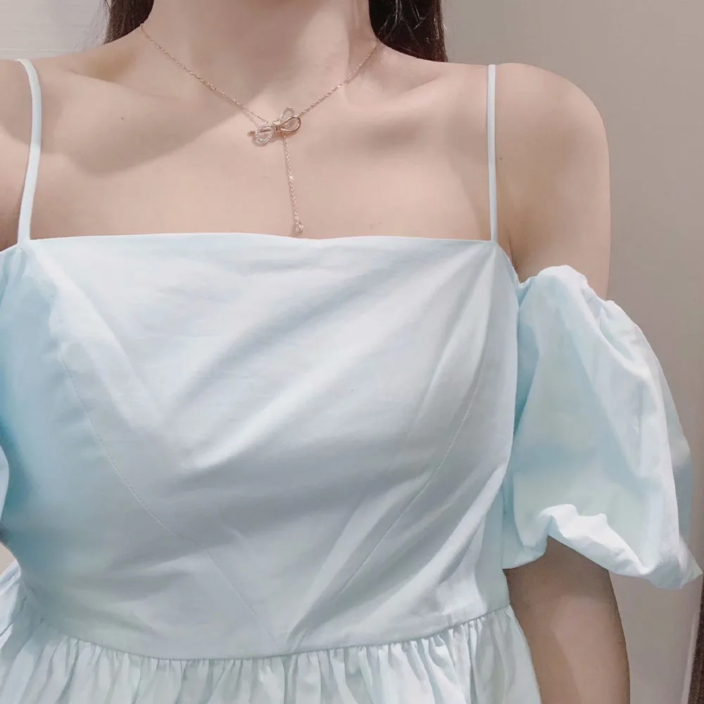 

Top New Women's 2021 Spring/Summer Fashion All-match Pure Color Poplin Puff Sleeve One-line Neck Short Ruffled Sling Shirt Top