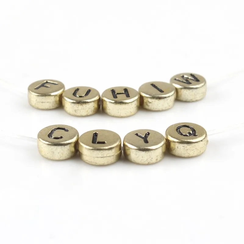 Акриловые бусины с английской надписью 4*7 мм круглые золотистые буквами алфавита