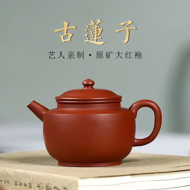 

Фиолетовый глиняный горшок Yixing, знаменитый чайный набор ручной росписи для изготовления сырой руды Dahongpao, старинный горшок из семян лотоса