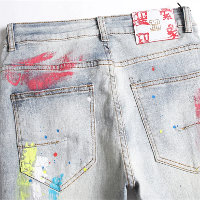 Korean Fashion Multicolour Graffiti Hip Hop Men Pencil Jeans Trousers Hole Ripped Slim Denim Pants For Nightclub Pantaloni Uomo
