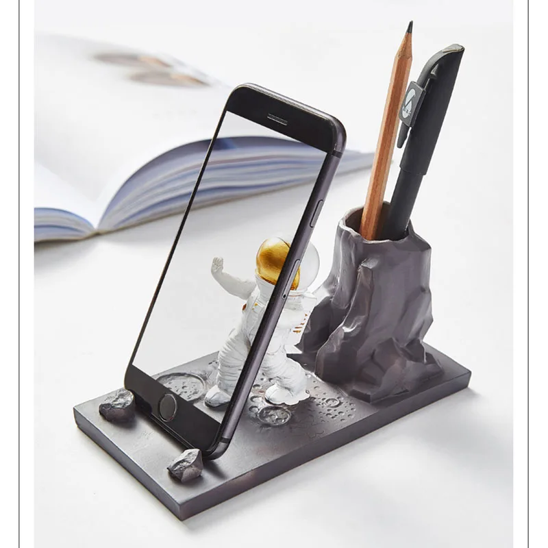 creative penholder mobile phone stand resin astronaut figurine home decoration office desk accessories practical desktop holder free global shipping