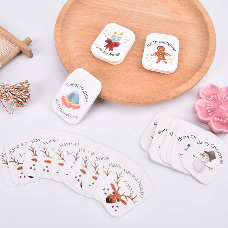 

50pcs Merry Christmas Paper Gift Tag Snowman Deer Santa Claus Paper Label Hang Tags Party DIY Decor Xmas Gift Wrapping Tags