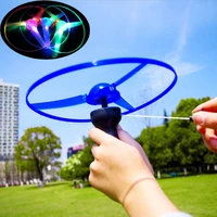 outdoor hot sale glow in the dark flashing toys funny pull string ufo led light up flying disc colorful kids toys for children