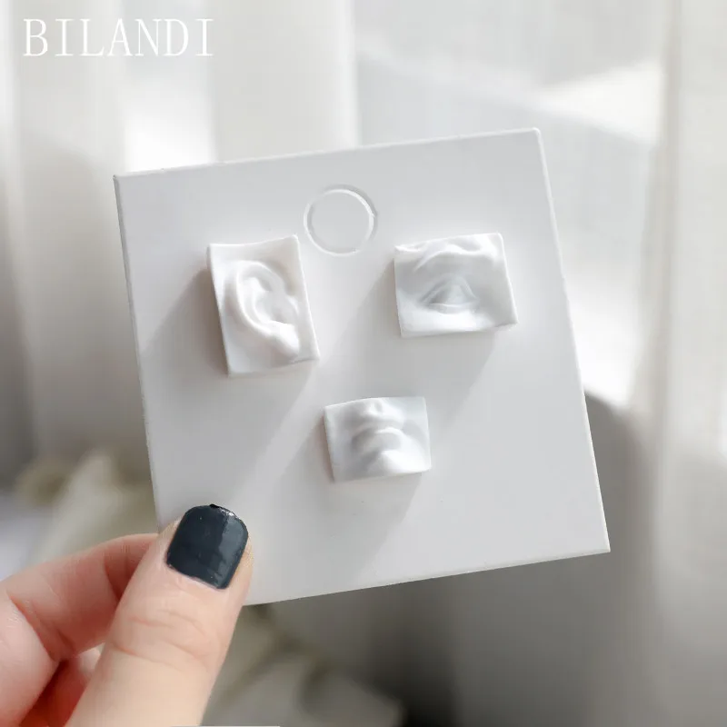 

Bilandi S925 needle 3pcs Cute Ear Eye Mouth Acrylic Earrings White Polymer Clay Vintage Geometric Stud Earring for Women Jewelry