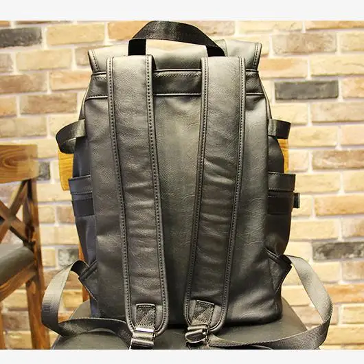 

Men's Bag Korean Version of the Campus Student School Bag Leisure Cool New Fashion Leather Backpack