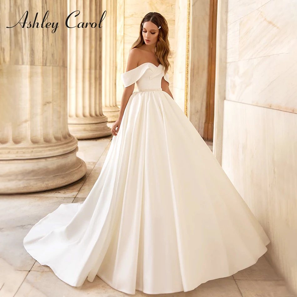 

Ashley Carol Ball Gown Wedding Dress 2023 Chic Satin Sweetheart Beading Sashes Pockets Cap Sleeve Wedding Gown Vestidos De Novia