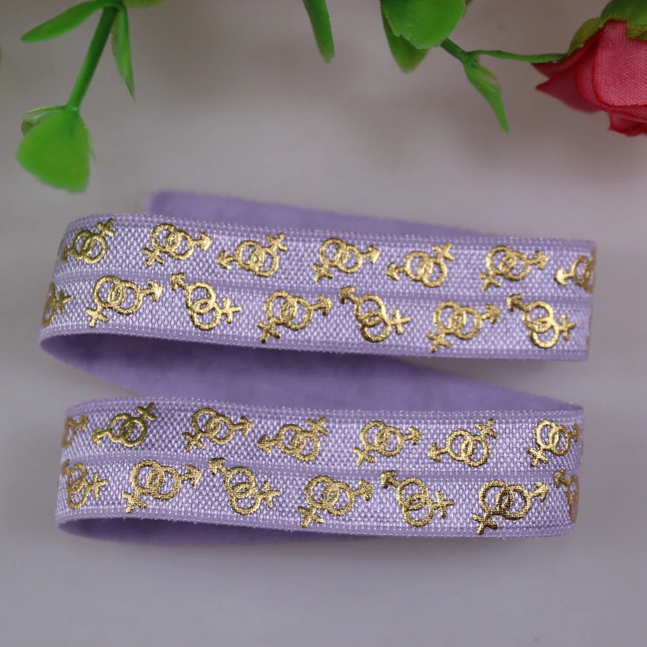 

Wholesale 5/8" New Design Gold Foil Male Female Couple Symbols Printed 430 Lt.Orchid FOE Fold Over Elastic Ribbon 100Yards