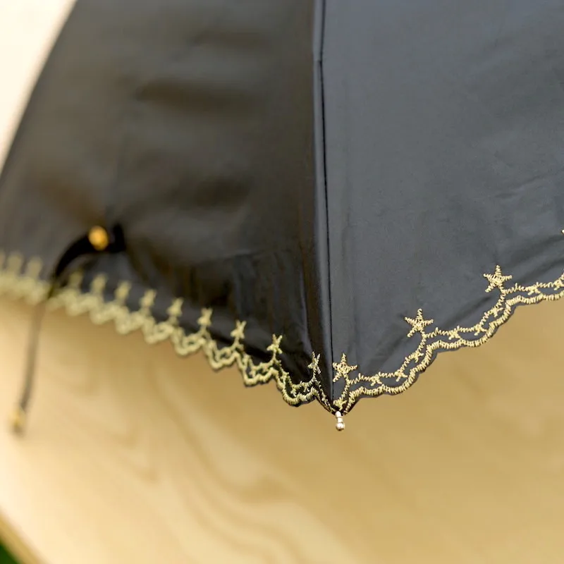

Curved handle embroidery stars black coating sunscreen three folding sunny and rainy women umbrella windproof strong umbrella