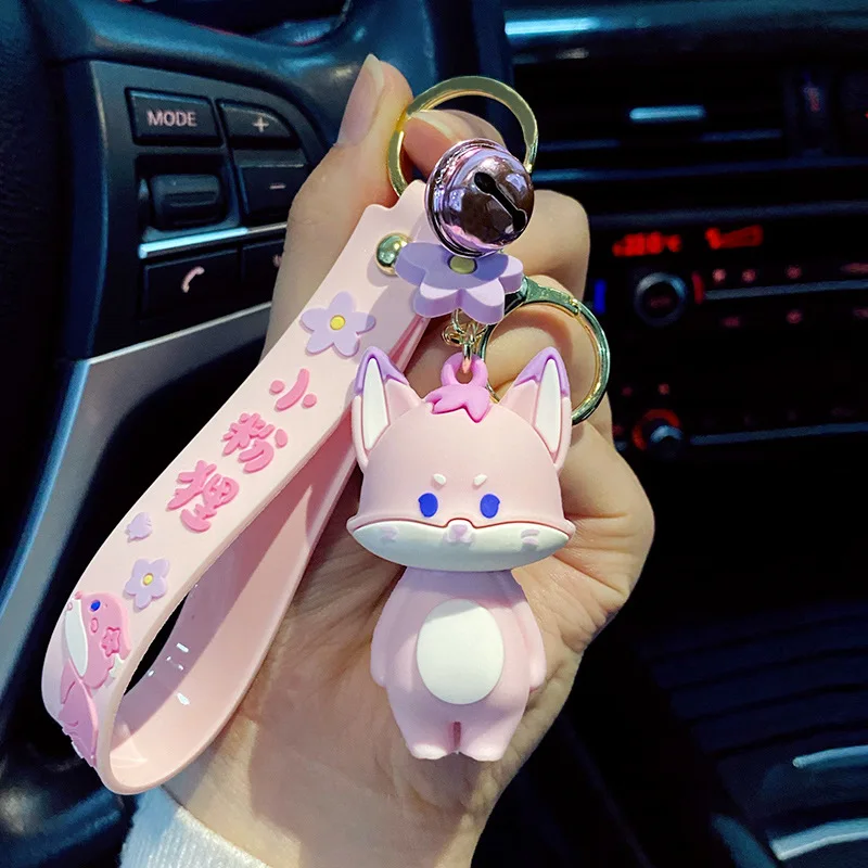 

Брелок для ключей с маленьким колокольчиком и розовой лисой