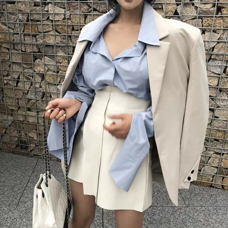 

Короткая ассиметричная юбка из искусственной кожи с высокой талией, черная или белая однотонная женская юбка из искусственной кожи, мини-юб...