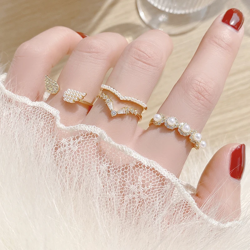 

Korean Exquisite Micro Inlaid CZ Angle Wing Pave Imitation Pearl Ring for Women AAA Cubic Bling Zirconia Bague Anillos Bijoux