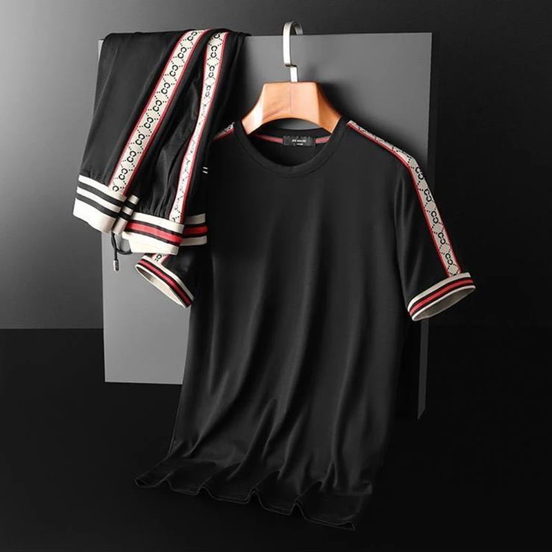 

Новинка, летние мужские спортивные брюки высокого качества из двух предметов с круглым вырезом и коротким рукавом, повседневный костюм, брю...