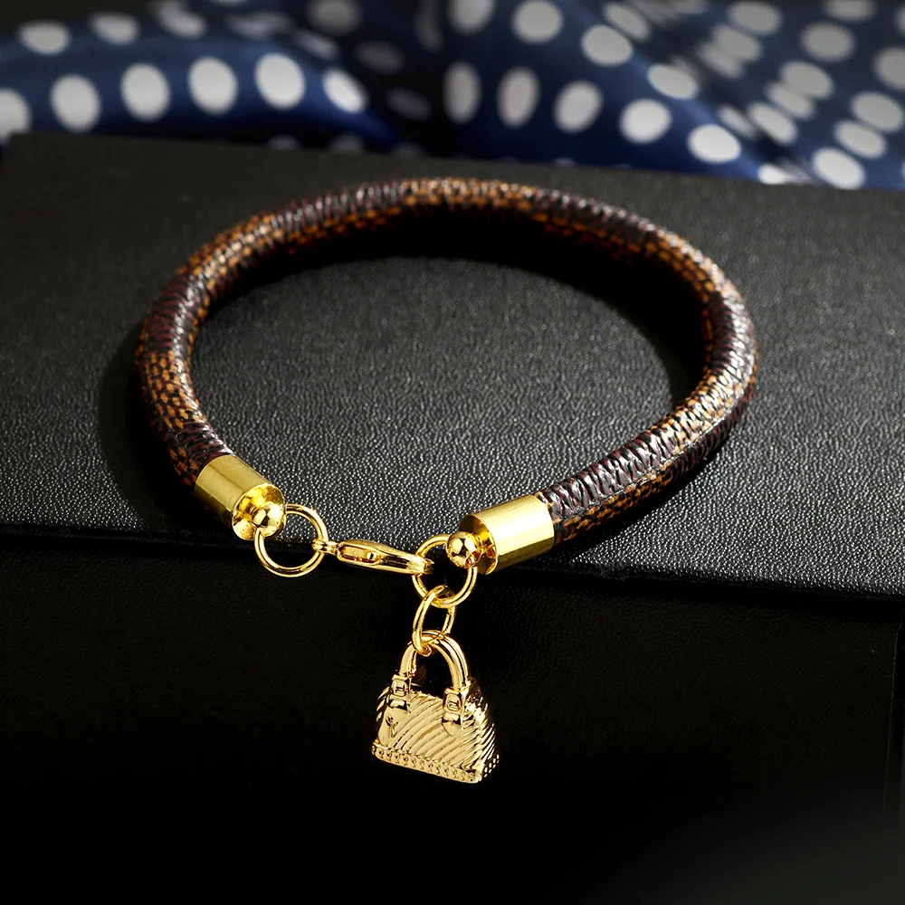 

Qinuo 2021 New Fashion Trendy Striped Bracelet Mini Bag Pendant Electroplating Bracelet Factory Direct Sales