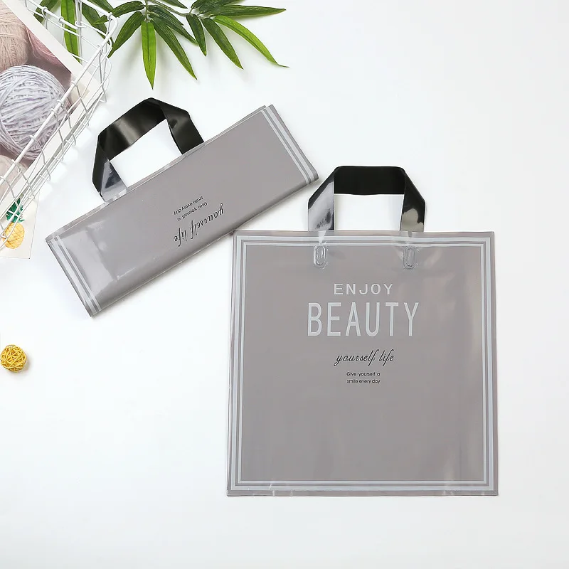 

50pcs Thick Large Plastic Bags Transparent English alphabet Gift Bag Clothing Store Packaging Bags With Handle Shopping Bag