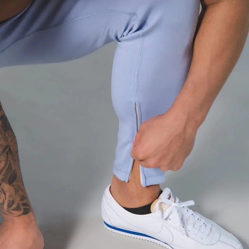 

Spring and autumn new muscle fitness sports and leisure trousers European and American slim men's breathable stretch pants