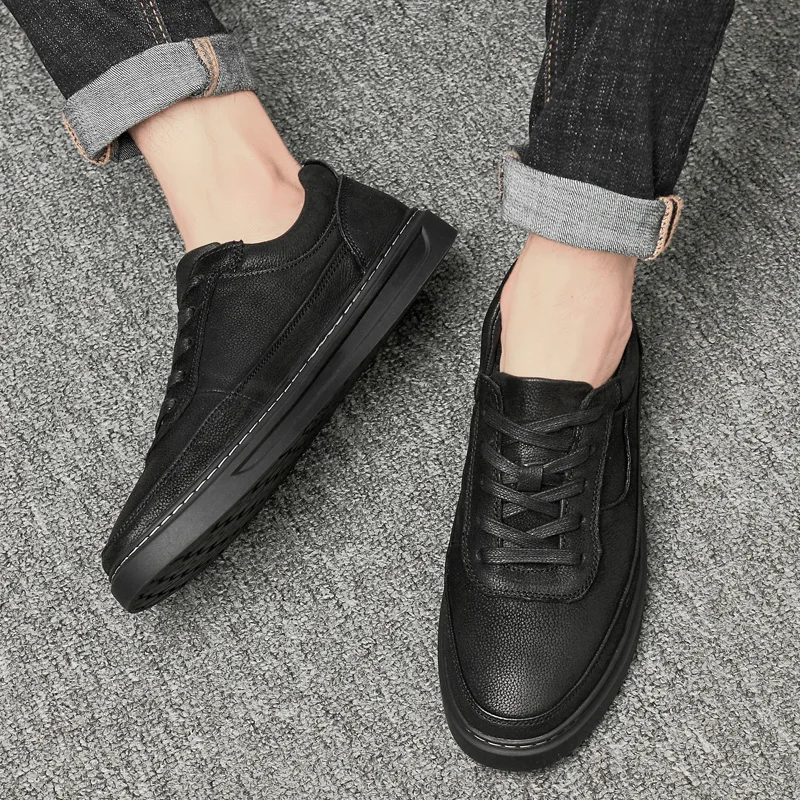 Мужские повседневные кроссовки из натуральной кожи черные или белые на плоской