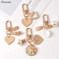 2021 cute pearl shell keychain bag key pendant ins metal jewelry creative small gift wholesale