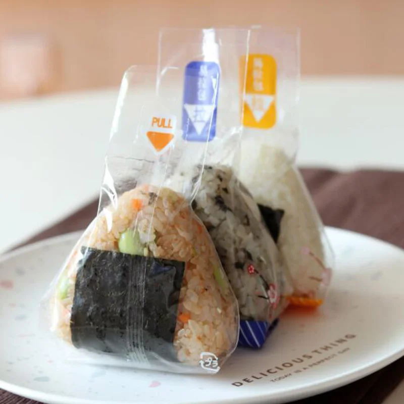 Bolsa de embalaje de bola de arroz triangular, bolsa antivaho de Panda en flor de cerezo, fácil de romper, embalaje de Sushi Onigiri, 100 Uds.