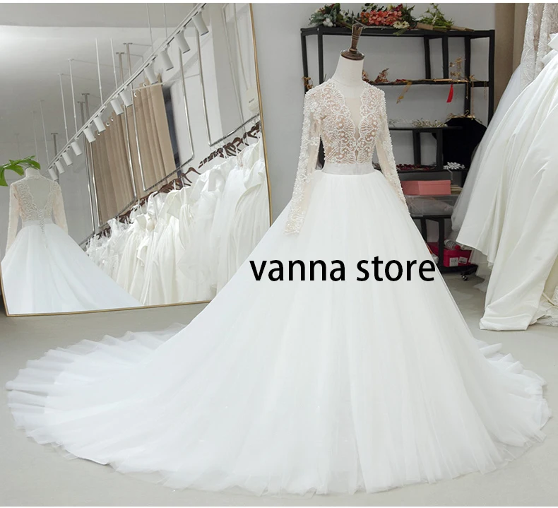 

2020 new arrive beading pearl wedding dress long stleeve V neck long train ball gown tulle bridal sexy backless elegant lace