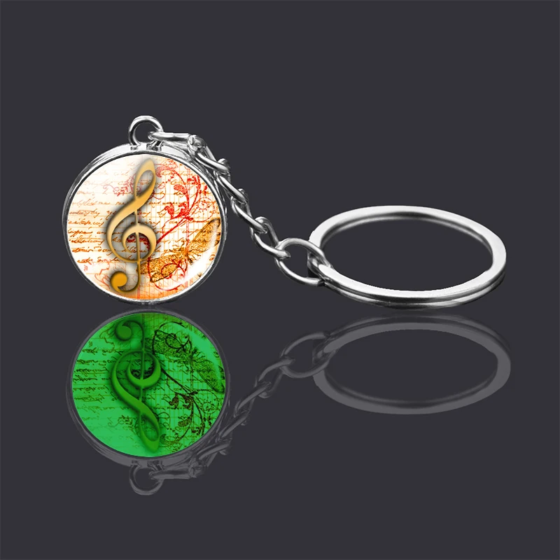 Световой с музыкальными знаками брелок двухсторонний стеклянный шар в виде