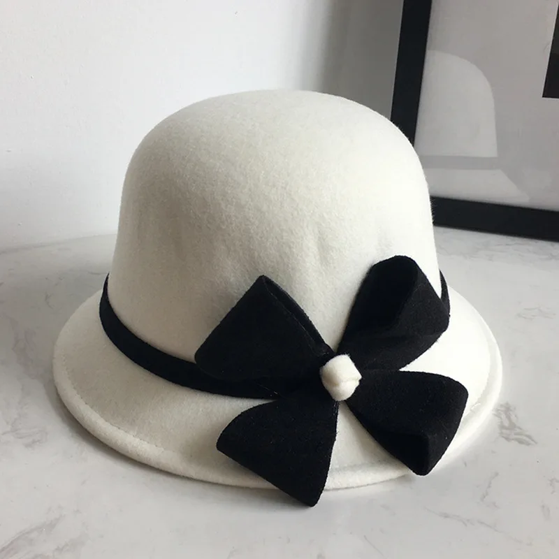 

Women's hat autumn and winter wool top hat Europe and the United Kingdom Ladies bowl hat elegant wild four-leaf fisherman hat