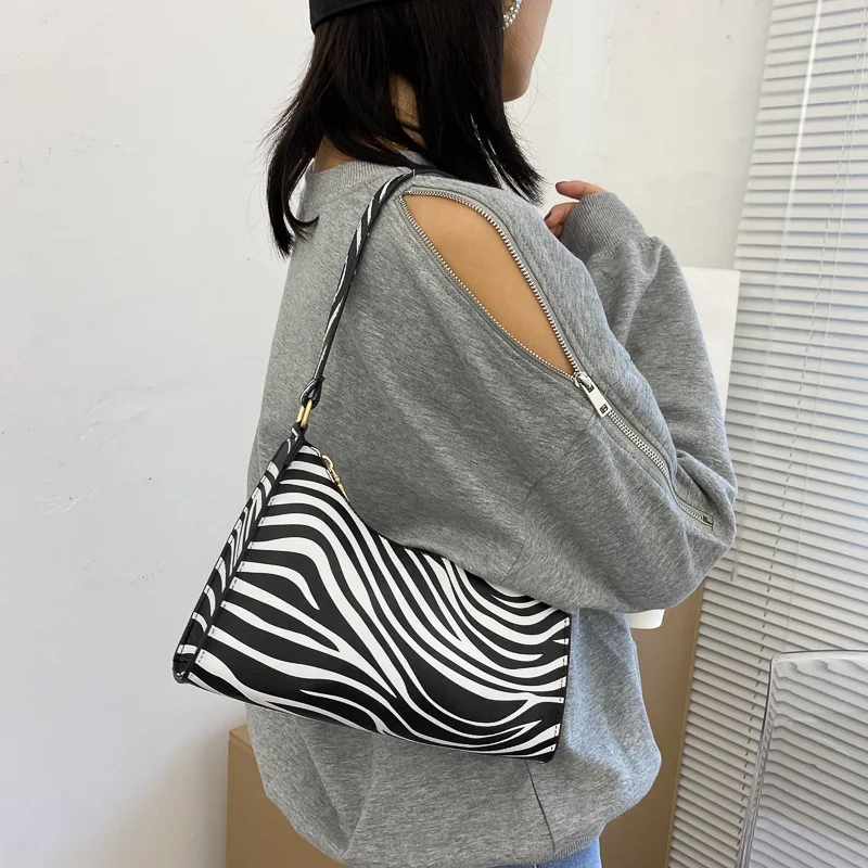 

Модная женская Роскошная сумочка с принтом зебры, из искусственной кожи, простые Наплечные сумки для подмышек, женские повседневные Дизайн...
