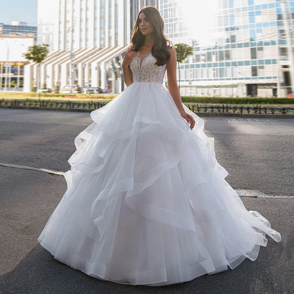 

Gorgeous Ball Gown Wedding Dress Sleeveless V Neck Ruffles Tulle Sweep Train Bridal Dresses Beading Applique Robe De Mariee