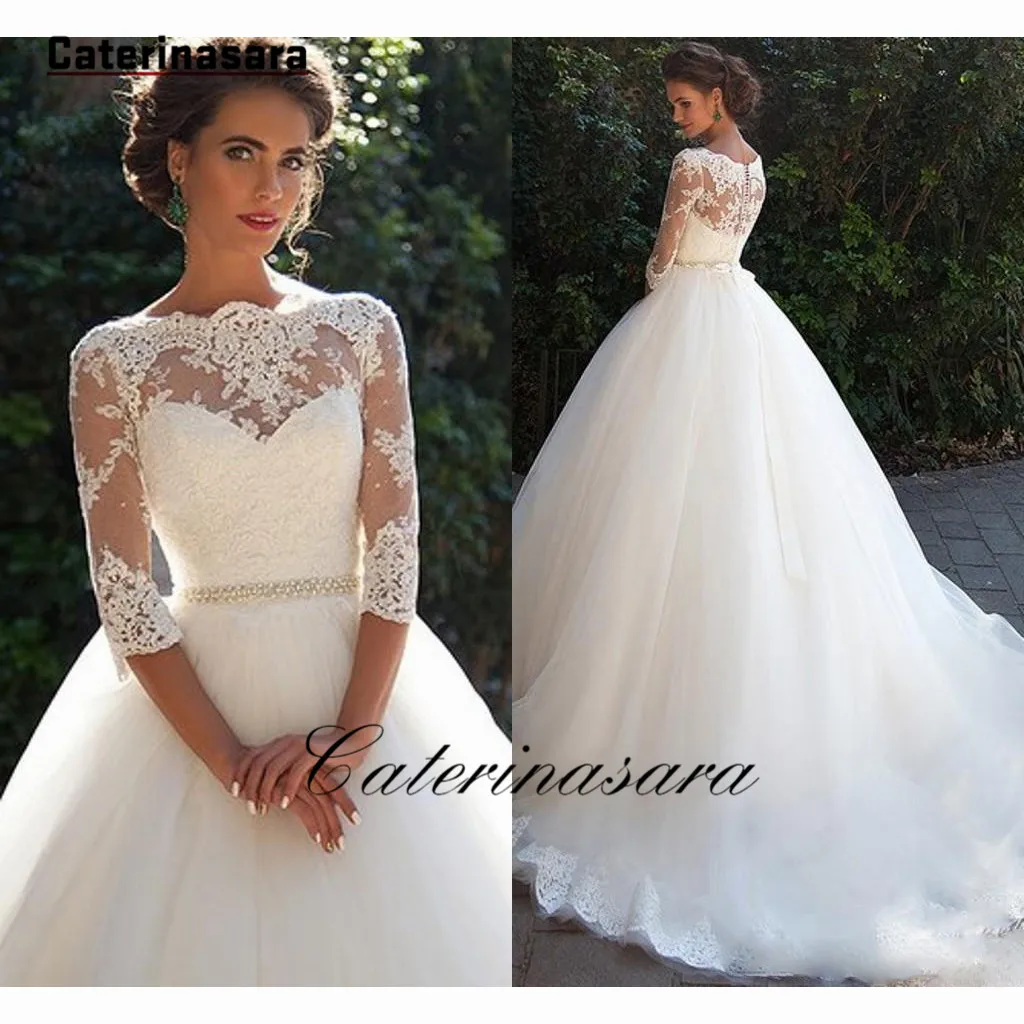 Кружевное свадебное платье цвета слоновой кости со стразами поясом тюлевым