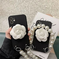 fashion stand holder camellia flower pearl bracelet hand chain case cover for iphone 12 mini 11 pro xs max x xr 8 7 6s plus se