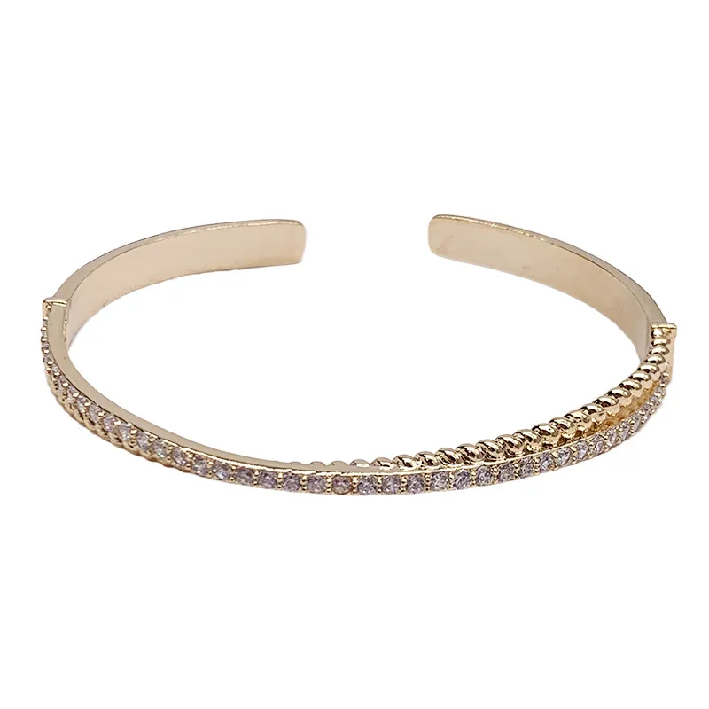 

Simple and cold wind curved cross line full diamond bow bracelet open bracelet female European and American high-end sense of je