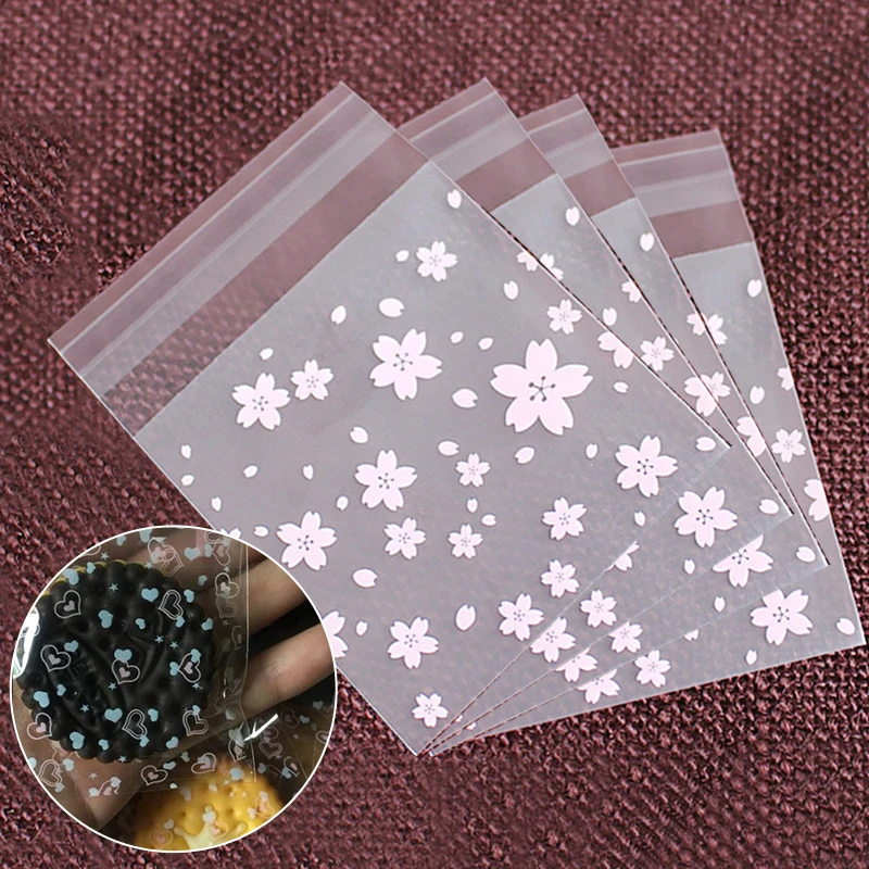

Packing Bag 100Pcs Sakura Printed Plastic Candy Bag Pink Frosted Self-Adhesive Baking Bag For Biscuit Snack Jewelry Gift Storage