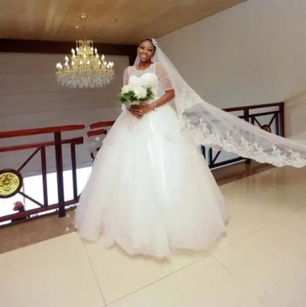 

Ball Gown Arabic Vestido De Novia Wedding Dresses Short Sleeves Sheer Jewel Neck Beads Sash Illusion Tulle Bridal Ball