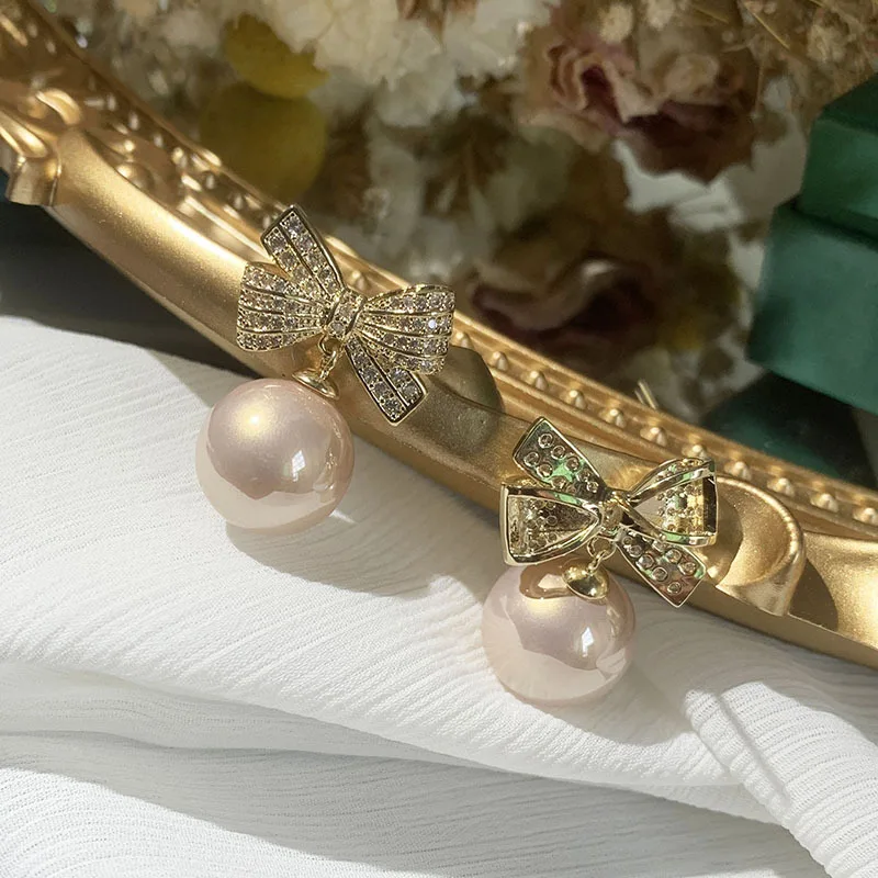 

Champagne Bow Earrings Sweet Temperament Small Elegant S925 Silver Ribbon Slim Round Face Earrings