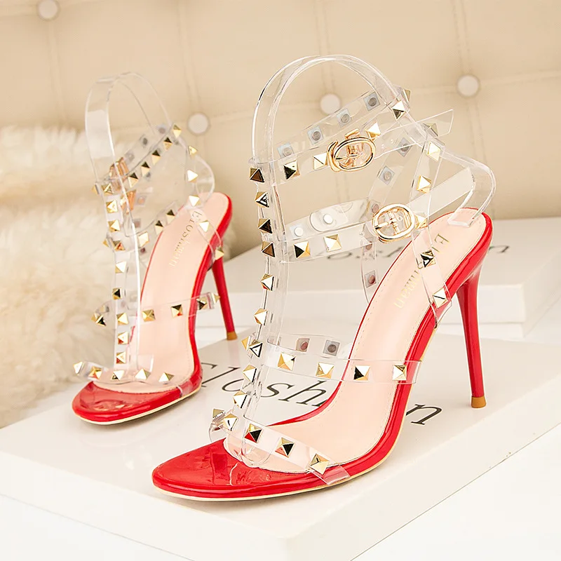 

European and American style sexy nightclub high heels patent leather metal rivet sexy nightclub sandals transparent Roman shoes