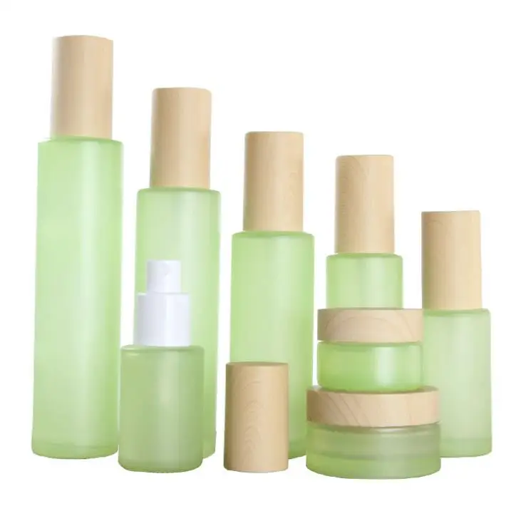 

50Pcs 20g 30g 50g 20ml 30ml 40ml 50ml 60ml 80ml 100ml Green Frost Glass Cream Jar with Wooden line Cap Lotion Spray bottle SN341