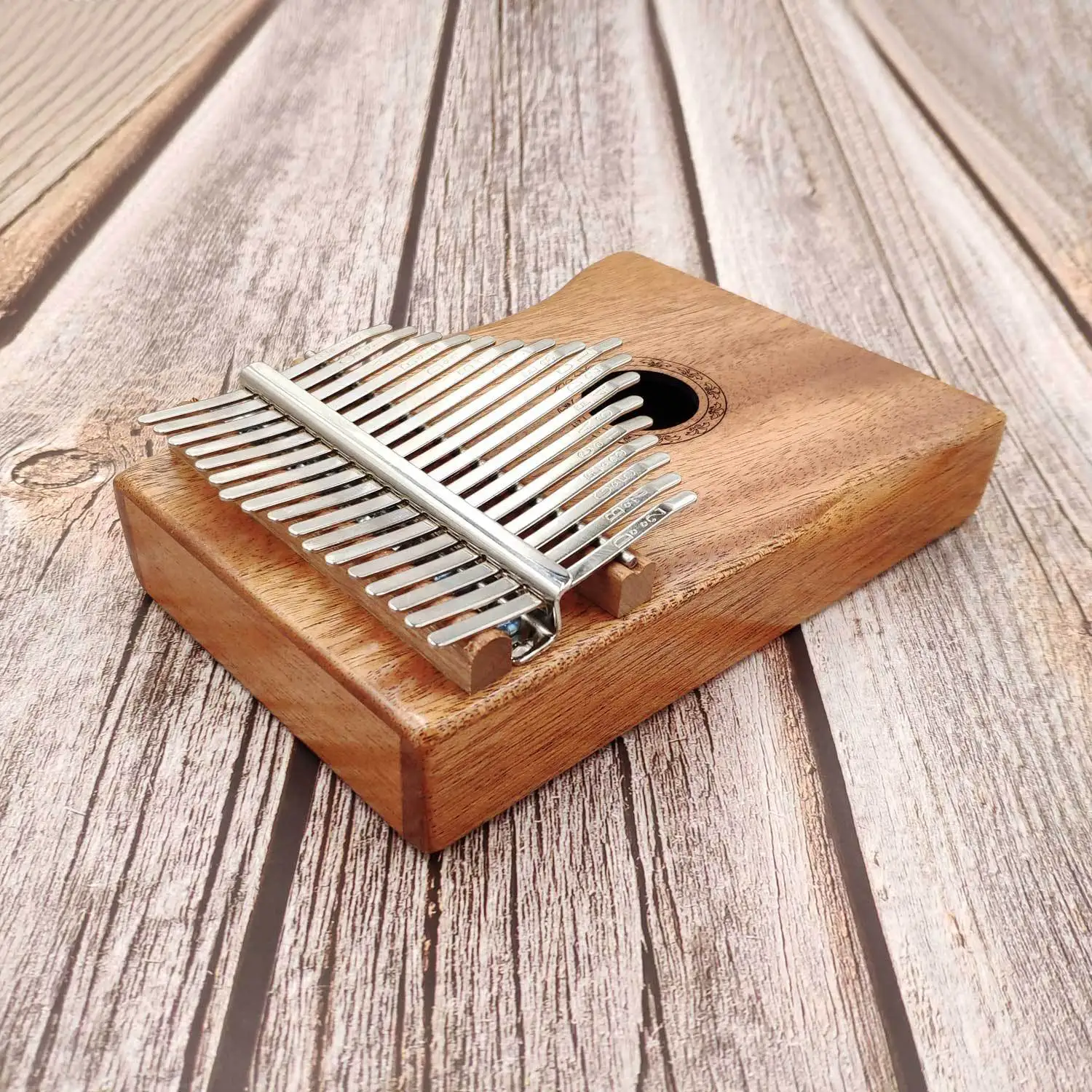 

The new thumb piano kalimba 17-tone finger piano beginner entry instrument built-in pickup thumb piano