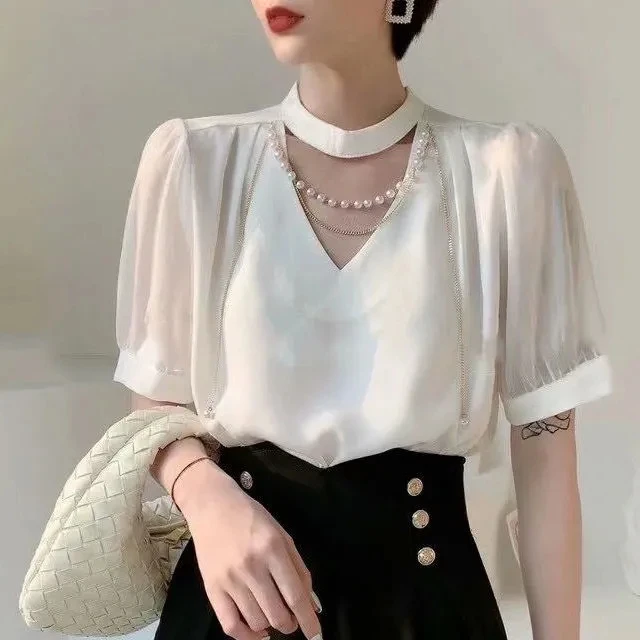 

Hollow chain round neck short sleeve shirt women's 2021 summer new high-end design sense niche white foreign style top