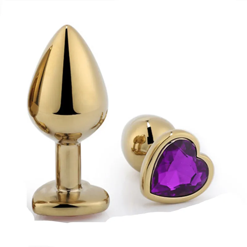 Анальная пробка золотого цвета в форме сердца металлическая с драгоценным