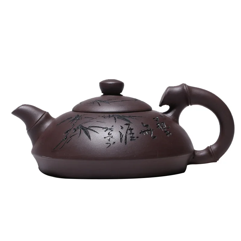 

Yixing hand engraved purple clay teapot raw ore