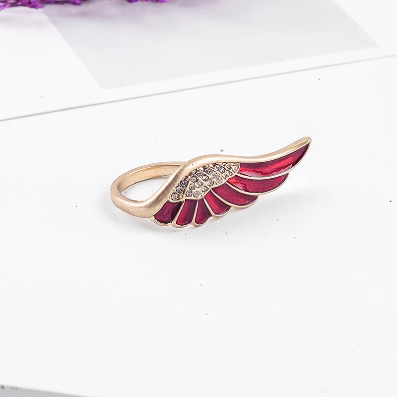 Изысканное украшение из кристаллов темно-красная эмаль крылья золотого цвета