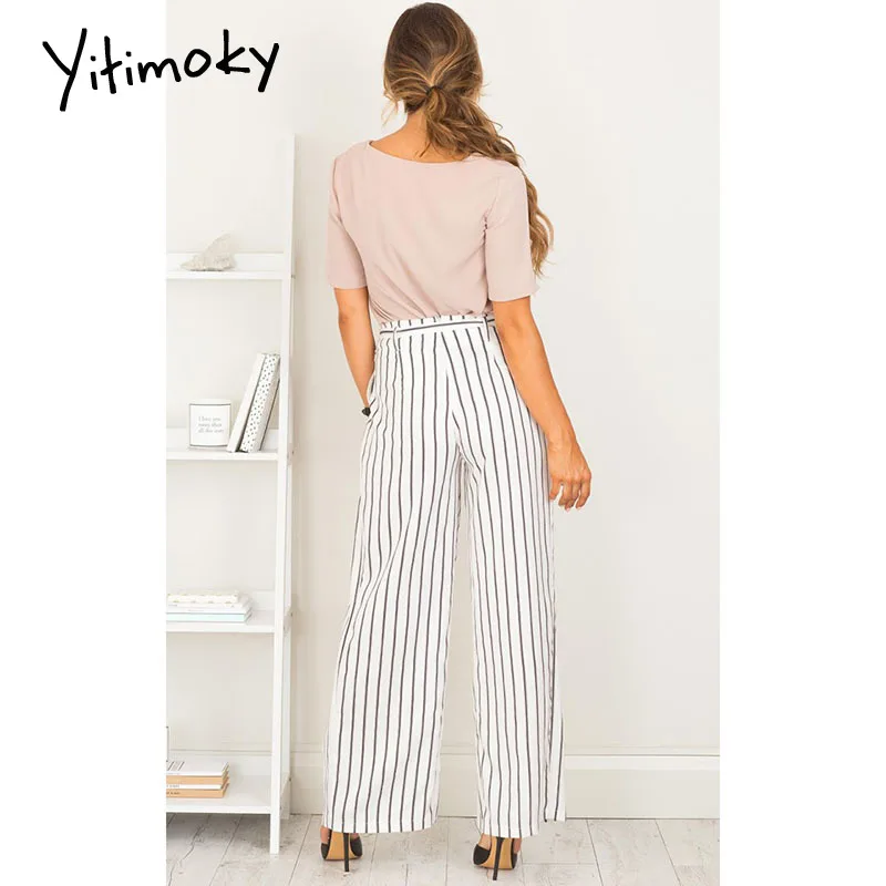 Весенние женские штаны с завязками на молнии черные полосатые белые высокой