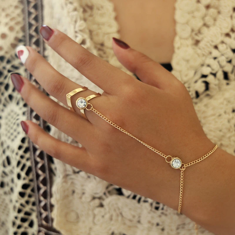 Женский золотистый браслет-кольцо с крупными кристаллами