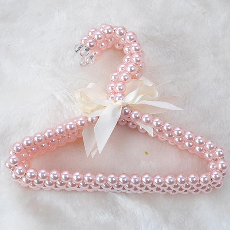 

Plastic Pearl Curved Bow Hanger Bow Tie Decoration Children's Clothes Rack Clothes Hanger Bead Hanger for Baby Kid