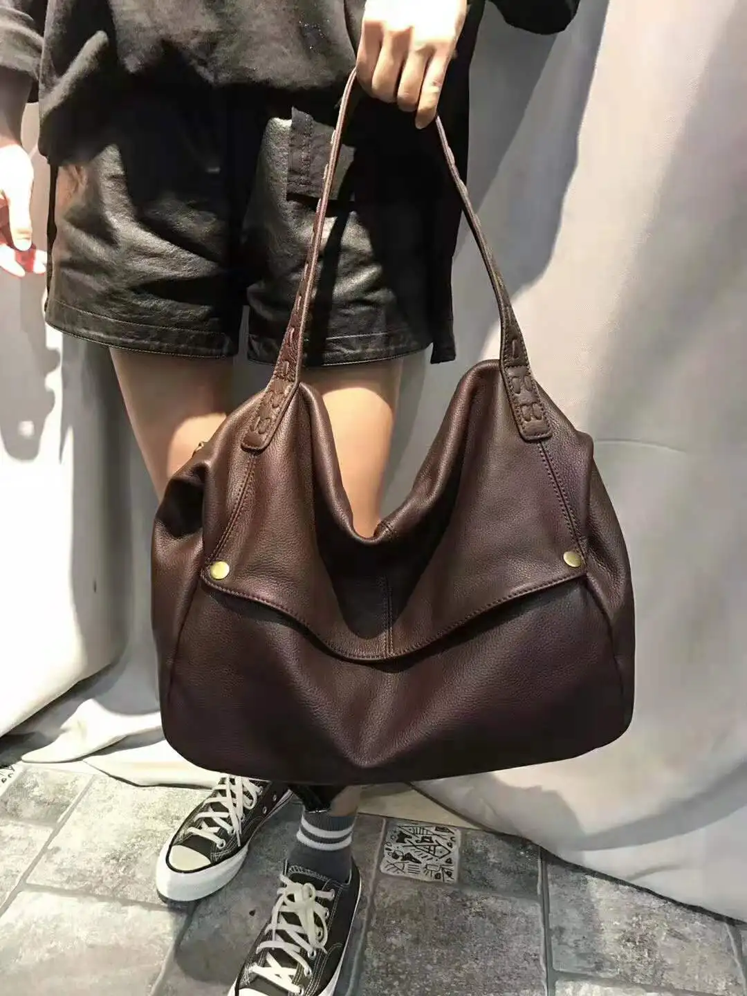 The New 2023 First Layer Cowhide Pandora Box Woven Bag is a One-Shoulder Cross-slung Bag for Women