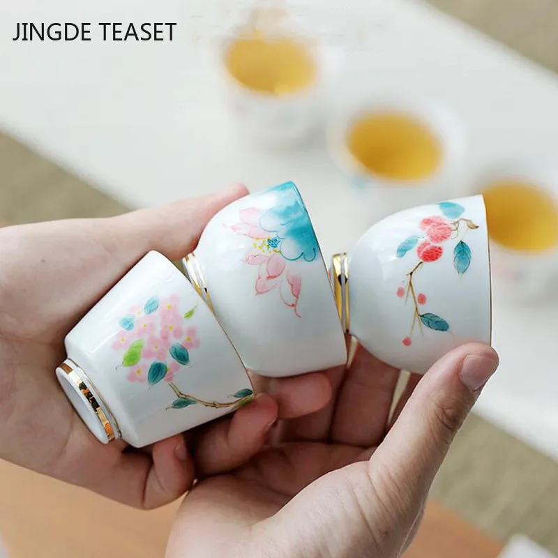 

4 pcs/lot Chinese Hand Painted Ceramic Teacup outline in gold Tea Bowl Handmade Porcelain Tea set Accessories Master Tea cup