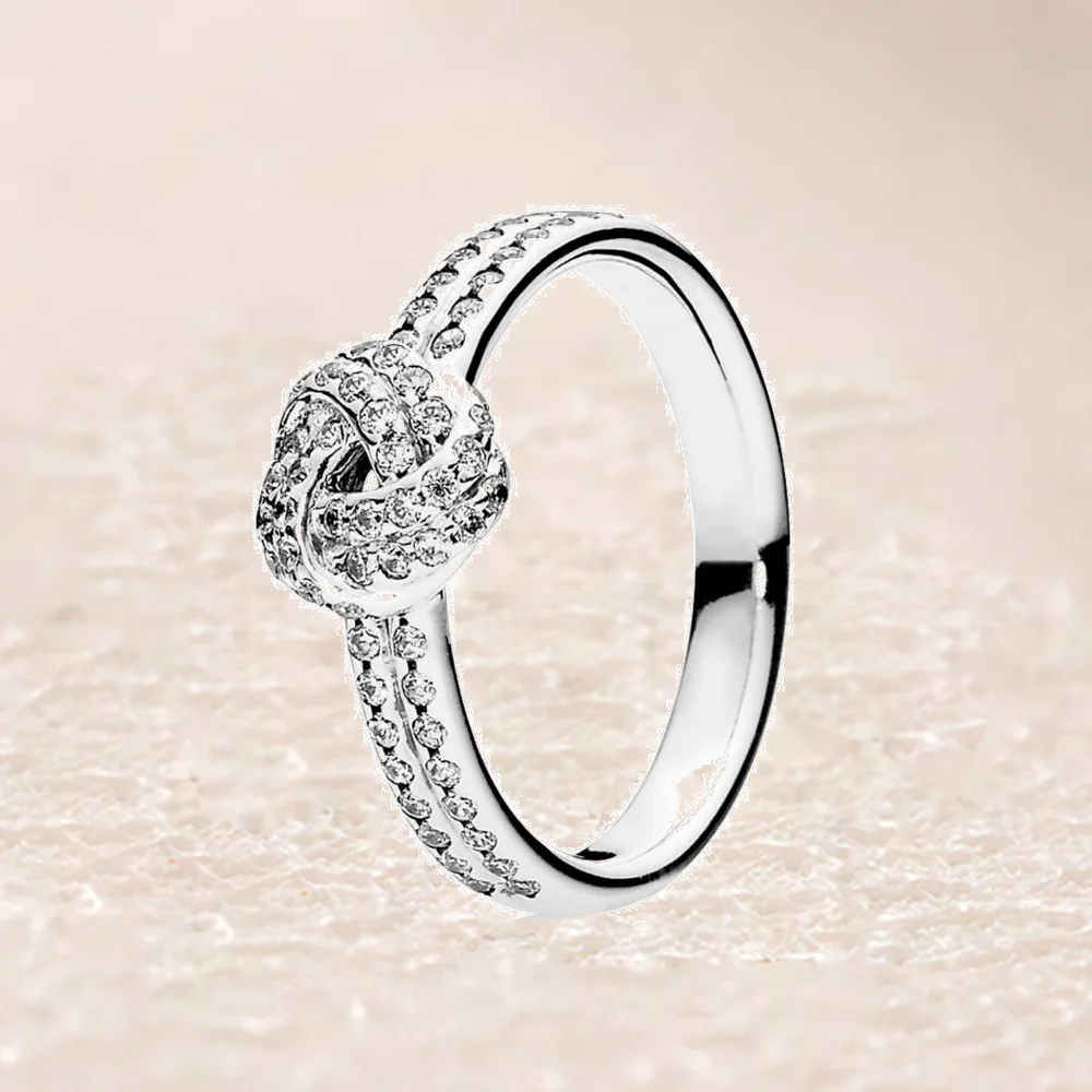 

190997CZ SPARKLING LOVE KNOT FEATURE RING