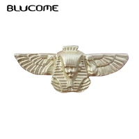 blucome gold matte metal abstract portrait human face brooches for women men vintage relief sphinx bird brooch lapel pins