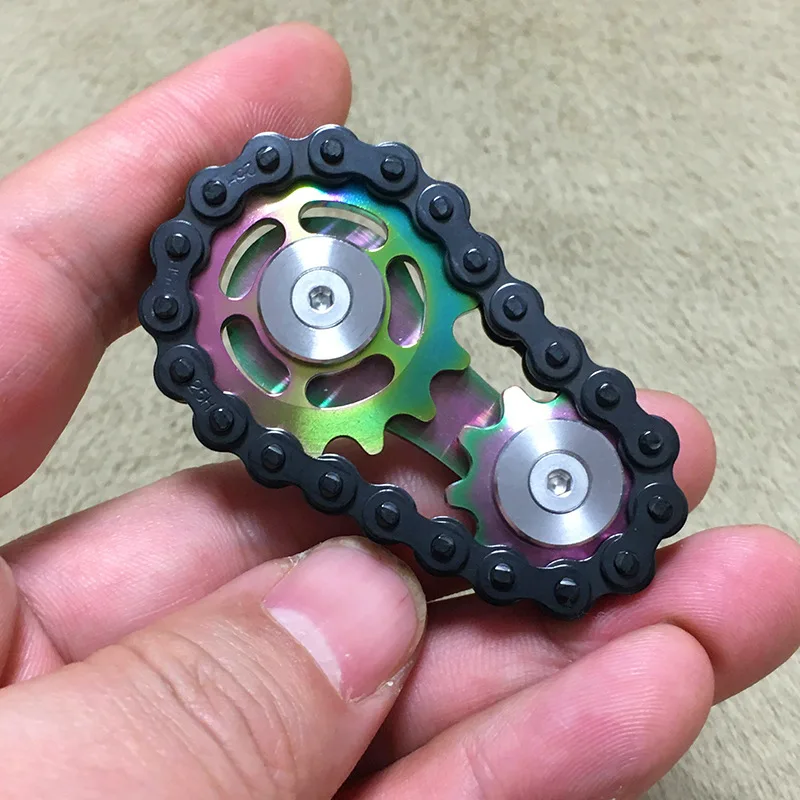 

The new black gear chain fingertip gyro-tooth flywheel decompression toy Amazon Blast fidget ring fidget spinner metal