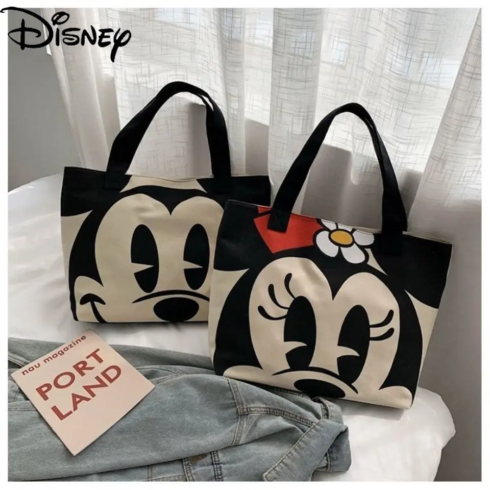 

Disney Ladies New 2021 Simple Printed Cartoon Flower Canvas Handbag Casual All-match Zipper Buckle Bucket Bag