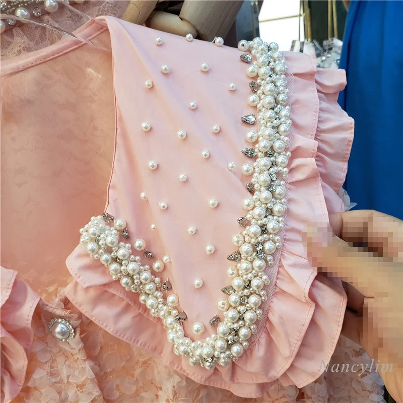 Chemise d'été en dentelle pour femmes, nouveau Style coréen, jolies perles, col de poupée, manches courtes bouffantes, Blouses assorties pour filles et dames, 2021